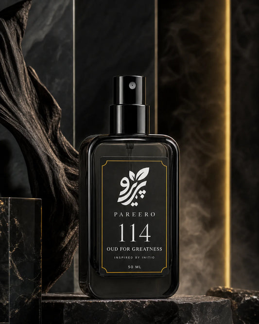 Pareero 114 inspired by Oud for Greatness hero fragrance image in black oud wood and gold lighting