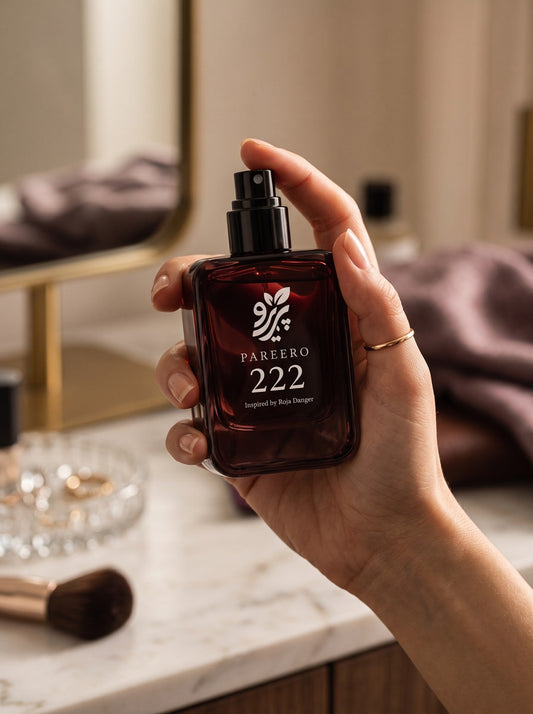 Pareero 222 inspired by Roja Danger handheld hero fragrance image in a refined vanity setting