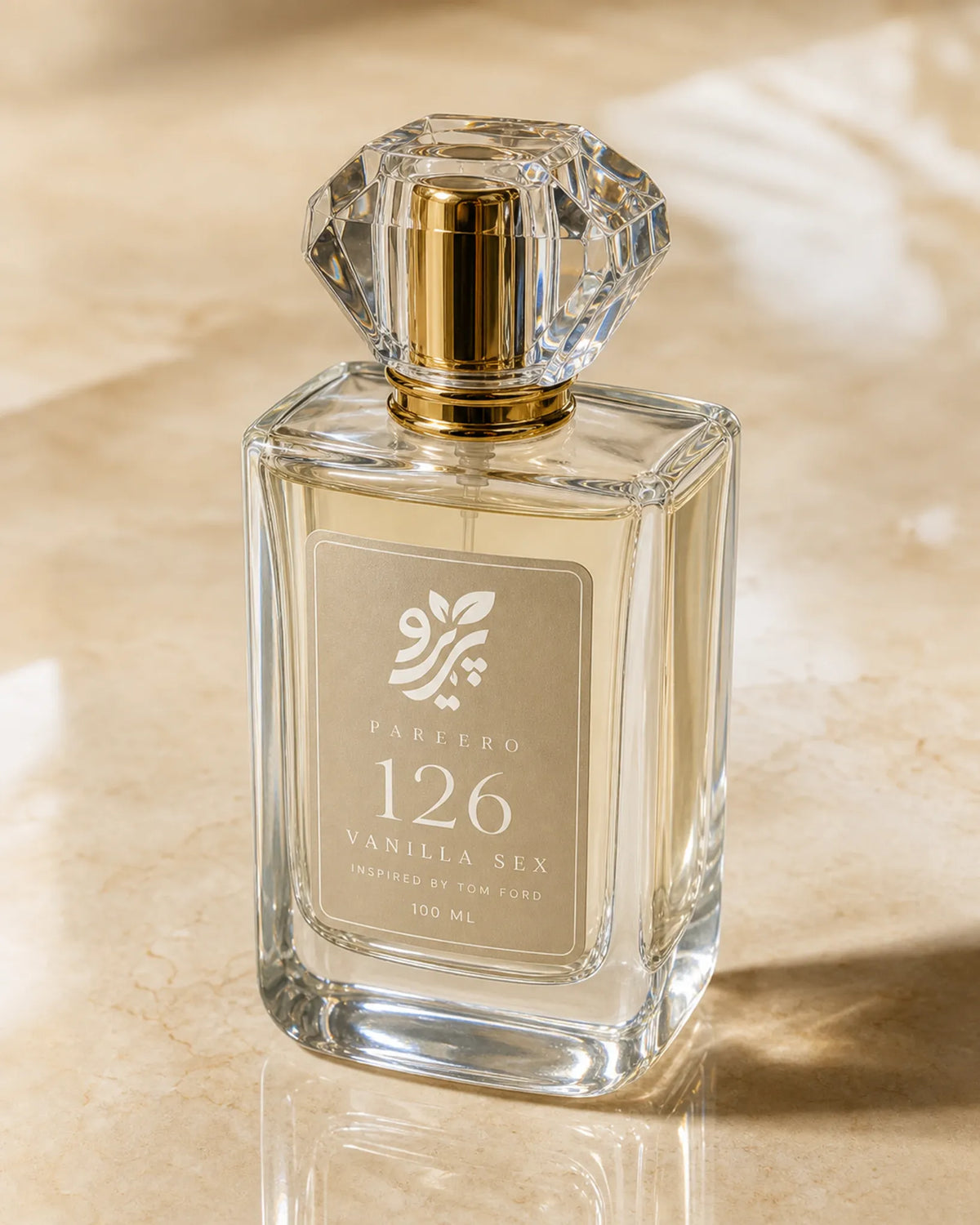 Pareero 126 inspired by Vanilla Sex three-quarter clear glass fragrance bottle image in warm golden light