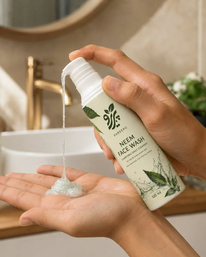 Hands dispensing Pareero Neem Face Wash gel during daily use