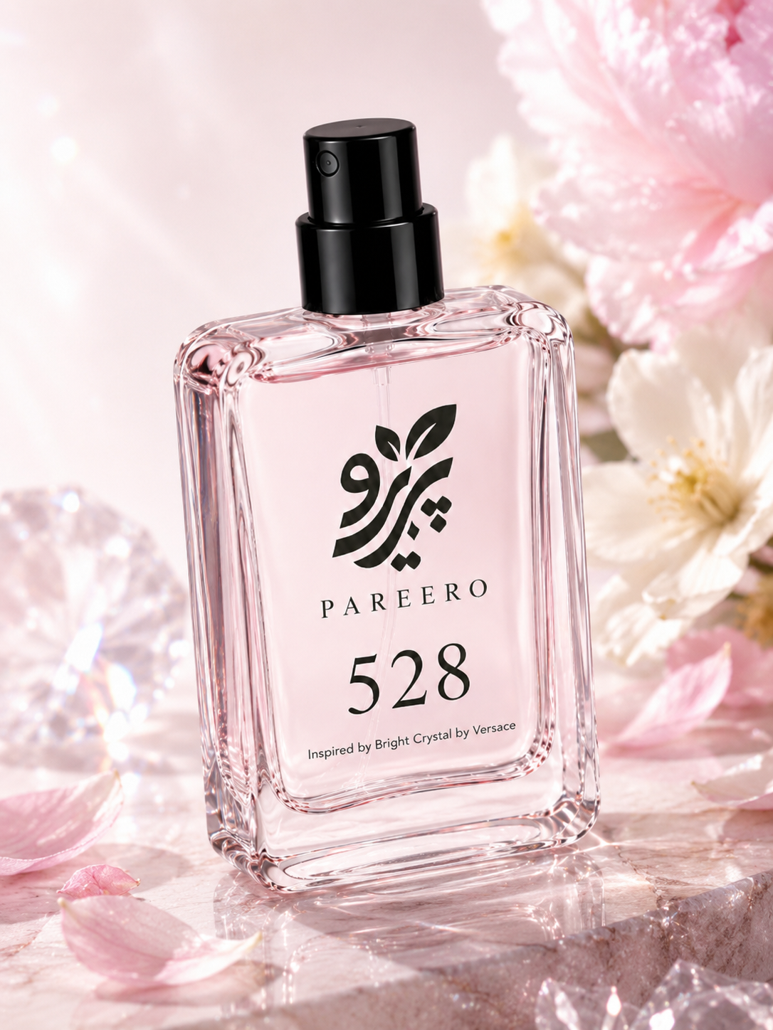 Angled PAREERO 528 fragrance bottle surrounded by soft pink and white flowers with crystal light