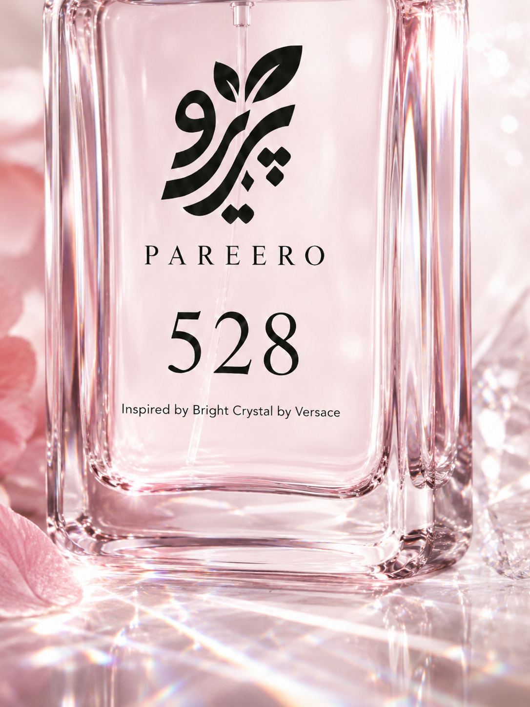 Macro detail of the PAREERO 528 fragrance label and luminous pink glass bottle