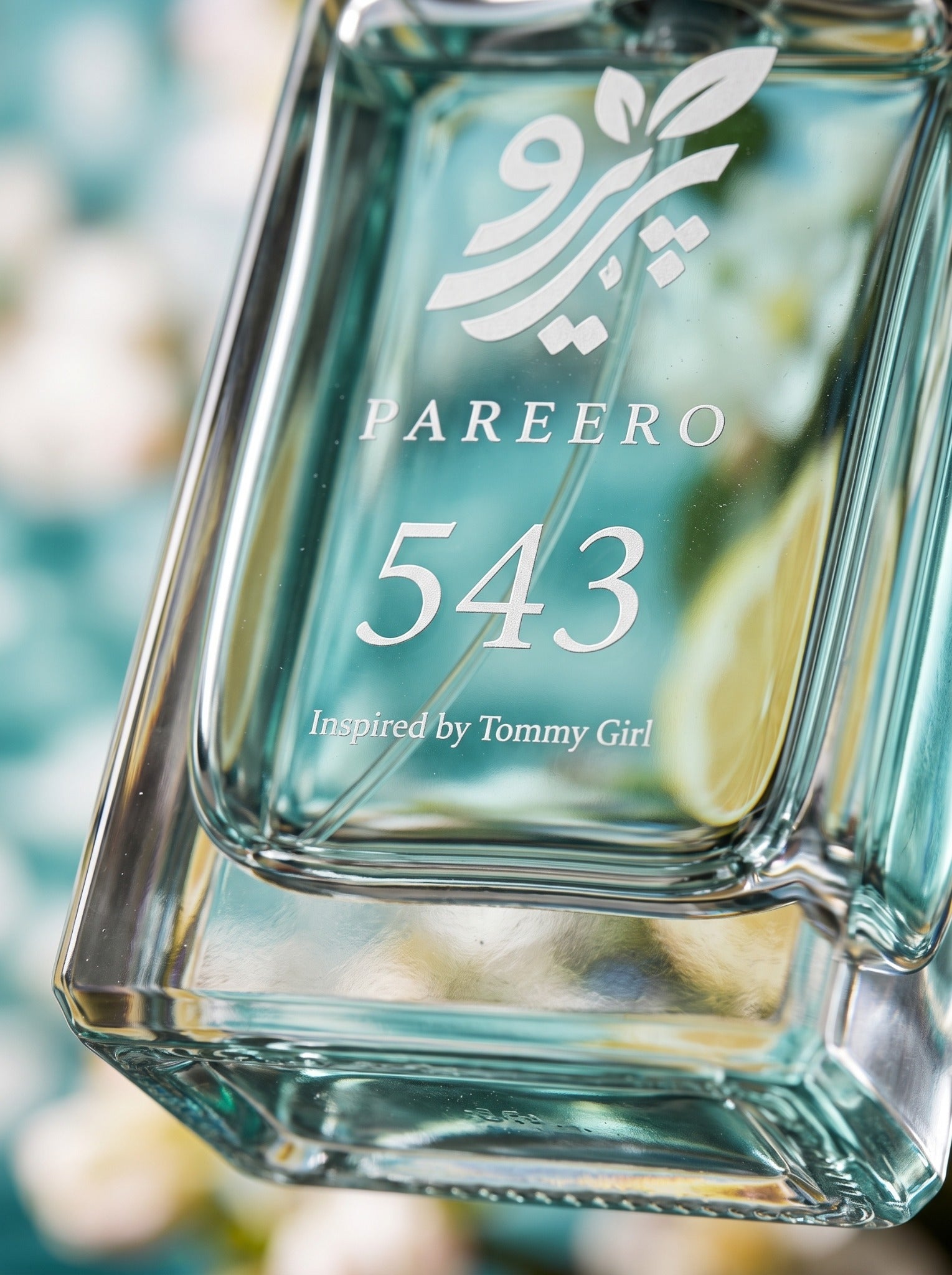 Macro glass and logo detail of PAREERO 543 Tommy Girl-inspired fragrance