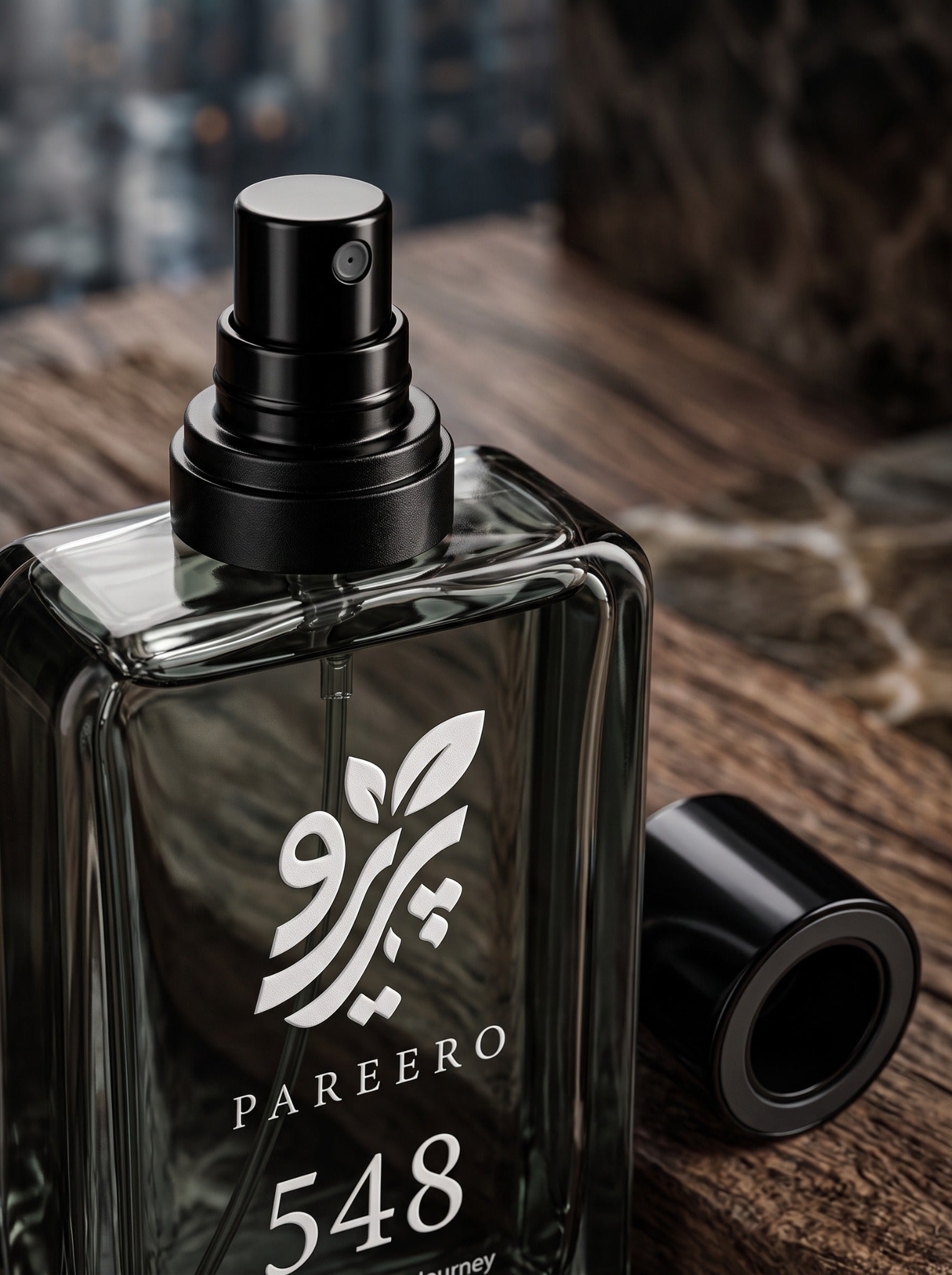 Macro view of the black atomizer and cap on the PAREERO 548 Urban Journey fragrance bottle
