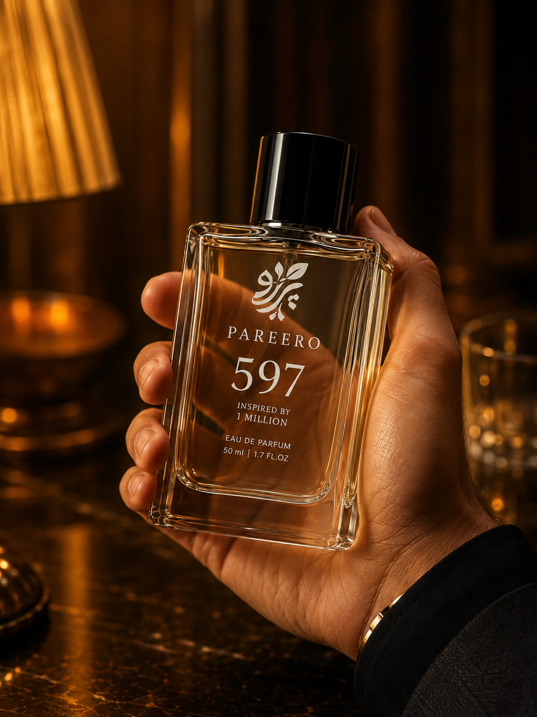 Hand holding PAREERO 597 inspired by 1 Million in an elegant warm evening interior