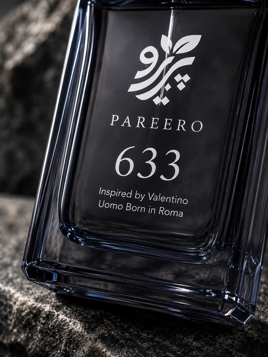 Macro detail of the PAREERO 633 Valentino Uomo Born in Roma inspired fragrance logo, number and dark glass bottle