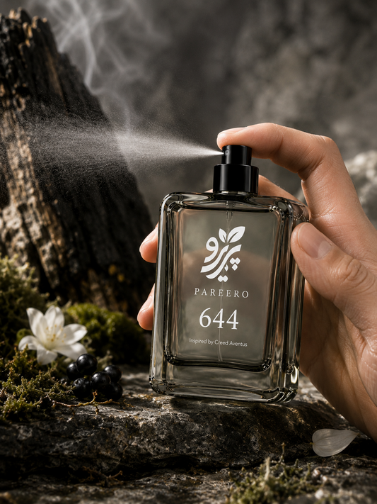 PAREERO 644 Creed Aventus inspired fragrance spraying in a smoky forest setting with blackcurrant, jasmine, moss and charred wood
