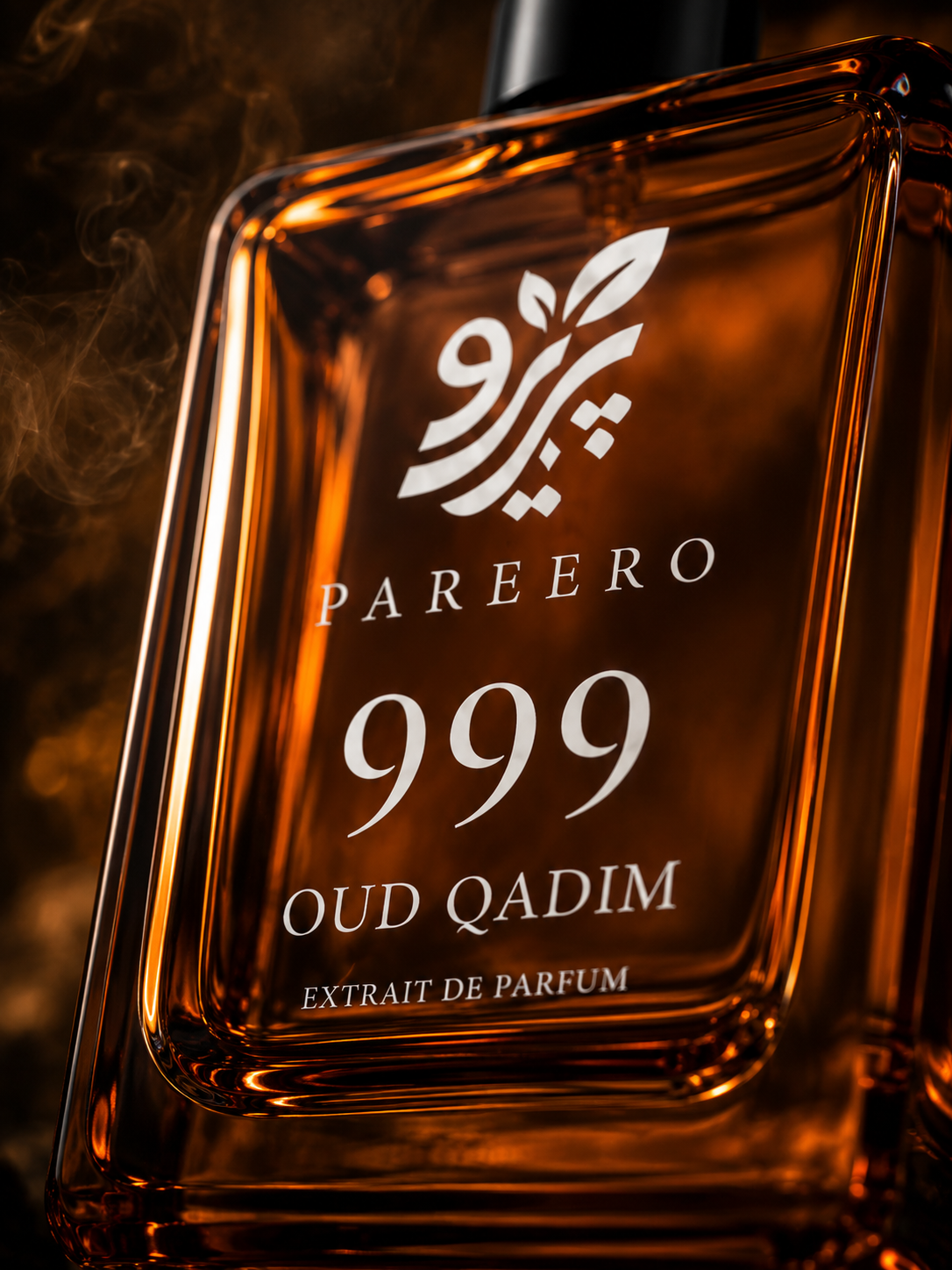 Close-up label detail of Pareero 999 Oud Qadim extrait de parfum bottle in warm amber light