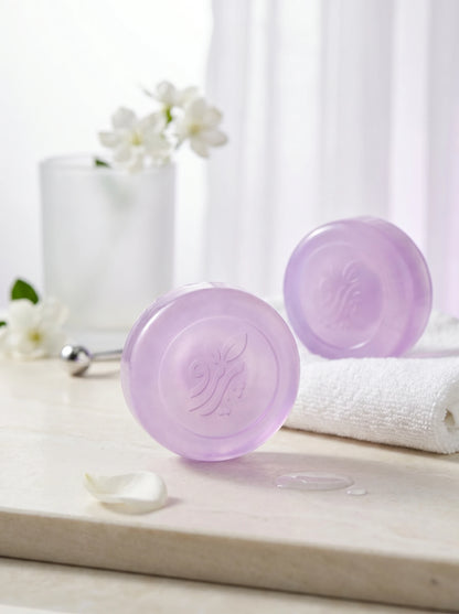 Pareero Tommy Girl lavender perfumed soap bars with embossed logo on marble tray with white jasmine flowers and towel